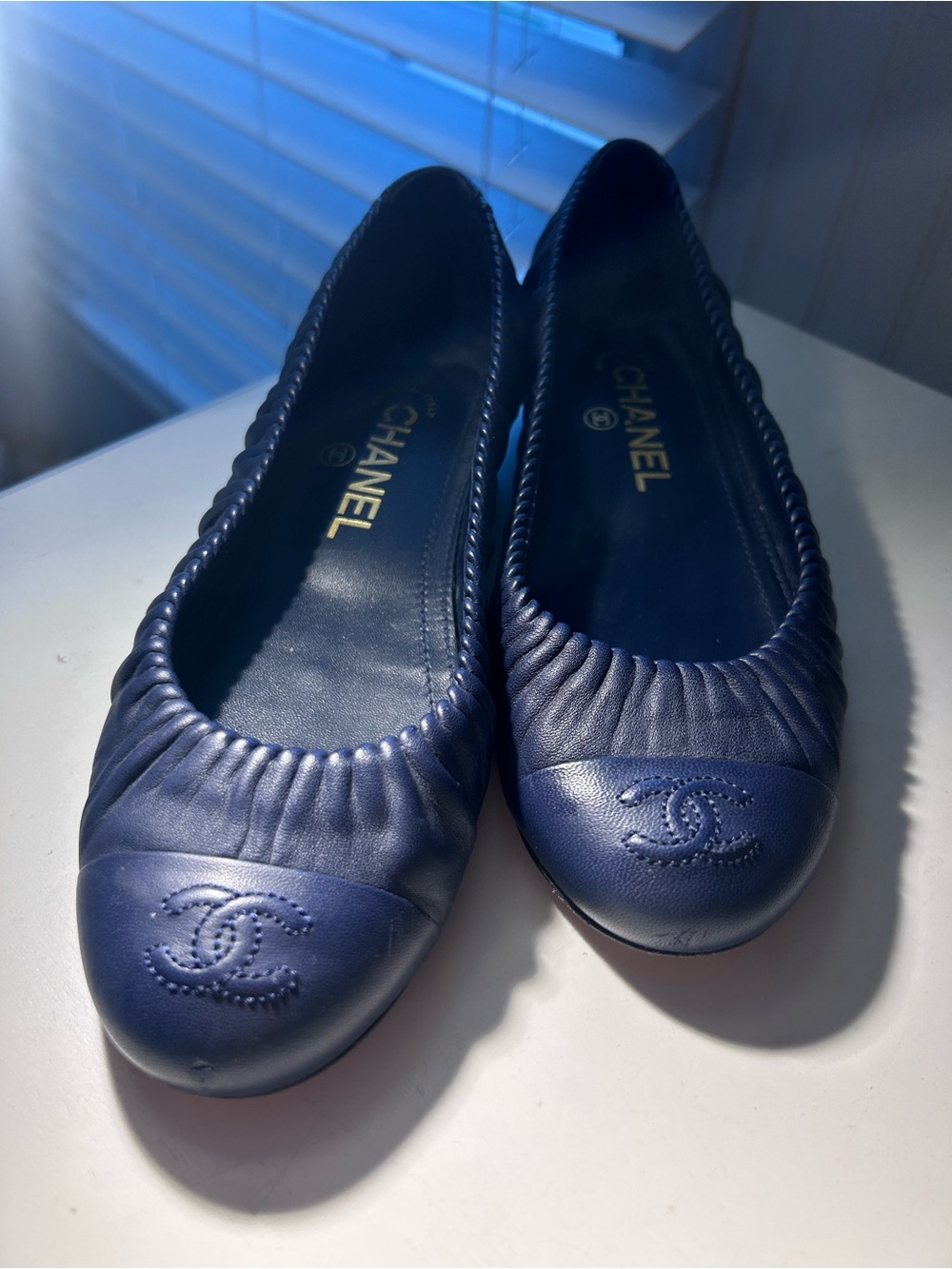 CHANEL Navy Blue Quilted Cap-Toe Ballet Flats